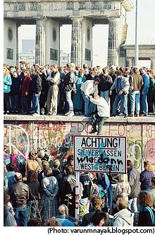 photo of people standing on Berlin Wall