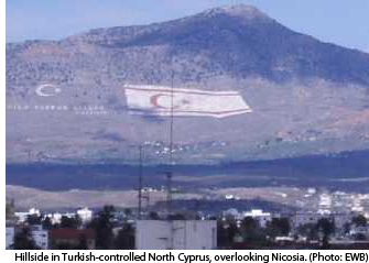 photo of hillside with large Turkish Cypriot flag